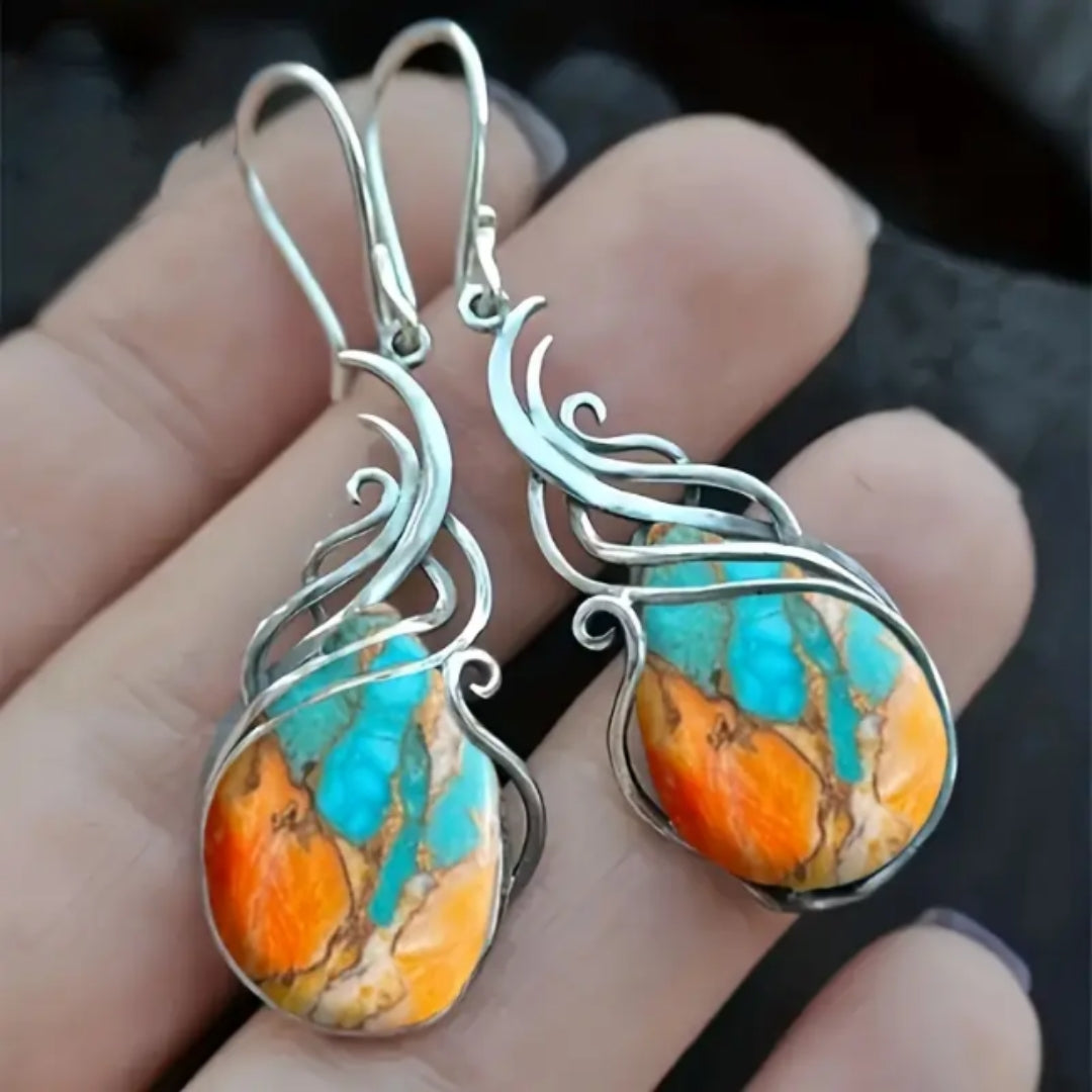 Boucles d'oreilles pendantes en pierres précieuses élégantes