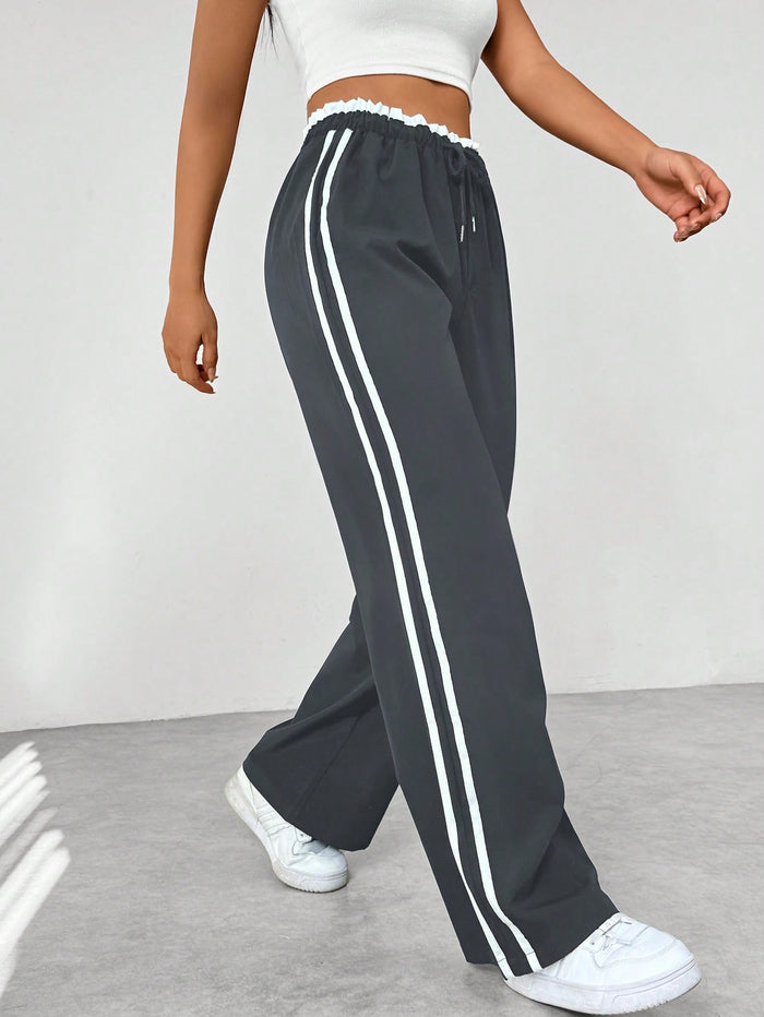 Pantalon femme avec rayures latérales et taille élastique