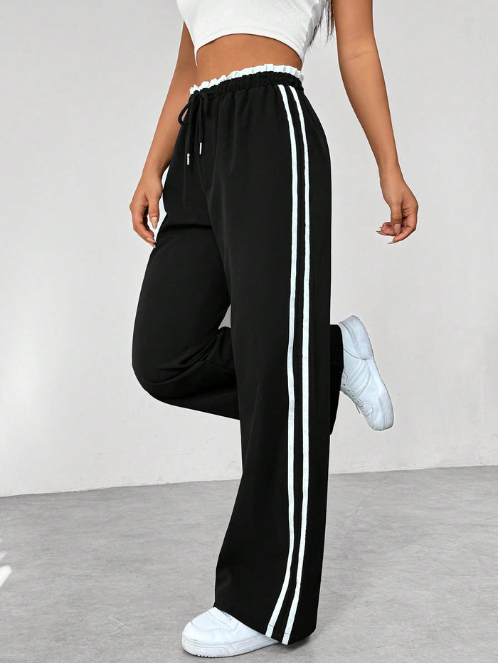 Pantalon femme avec rayures latérales et taille élastique